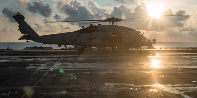 An MH-60R Sea Hawk from the Helicopter Maritime Strike Squadron (HSM) 78 Blue Hawks preparing to take off from the USS Carl Vinson (CVN 70).
