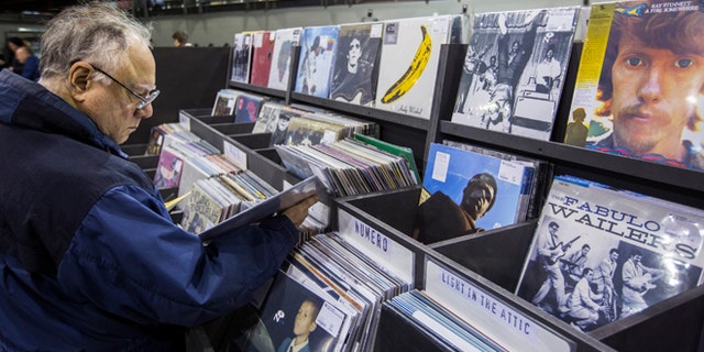 Nov. 25, 2013: A man peruses albums displayed inside of the record store Rough Trade in the Williamsburg neighborhood of Brooklyn.