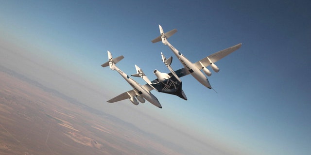 The Virgin Galactic suborbital spaceliner SpaceShipTwo makes its first crewed flight on July 15, 2010 over the Mojave Desert in California, one of a series of test flights before the first free flight of the passenger ship for space tourism flights.