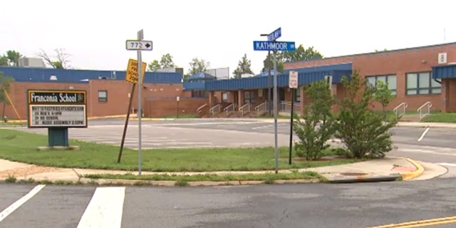 Fairfax County Police said the boy and teacher both simultaneously pressed a button to open a large, motorized room partition that splits in the middle.