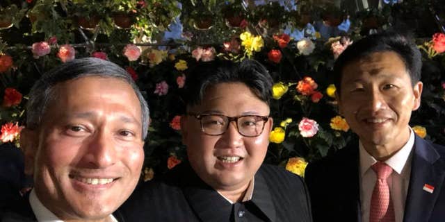 Singapore Foreign Minister Vivian Balakrishnan and Education Minister Ong Ye Kung with Kim Jong Un.