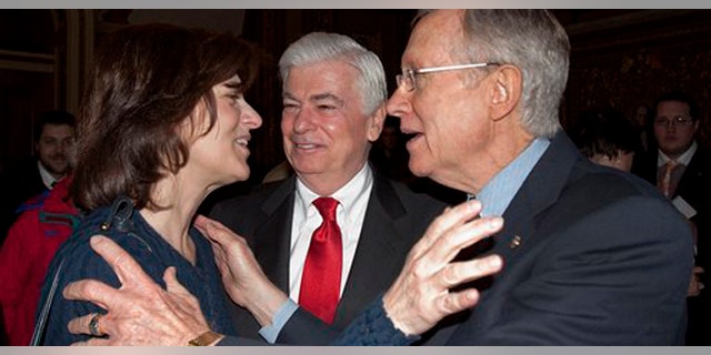 Thursday: Victoria Kennedy, widow of Sen. Ted Kennedy, hugs Senator Majority Leader Harry Reid after passage of the health insurance overhaul. Banking Committee Chairman Christopher Dodd, D-Conn, looks on. (AP Photo)