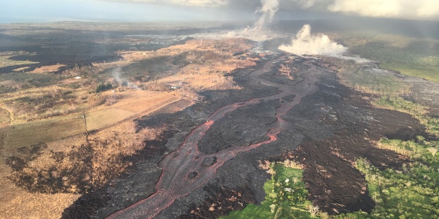 The difference in landscapes on the northern and southern sides of the fissure 8 lava channel can be seen in this aerial photo.
