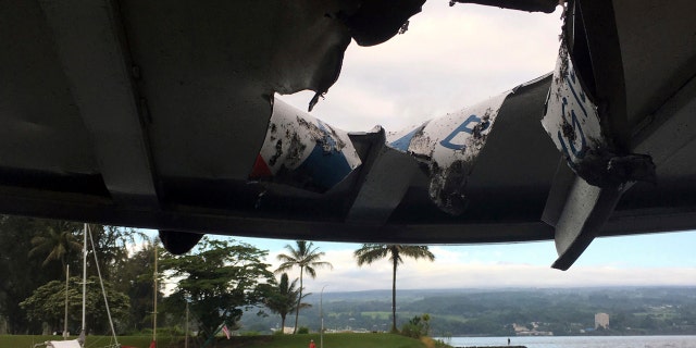 This photo provided by the Hawaii Department of Land and Natural Resources shows damage to the roof of a tour boat after an explosion sent lava flying through the roof off the Big Island of Hawaii.