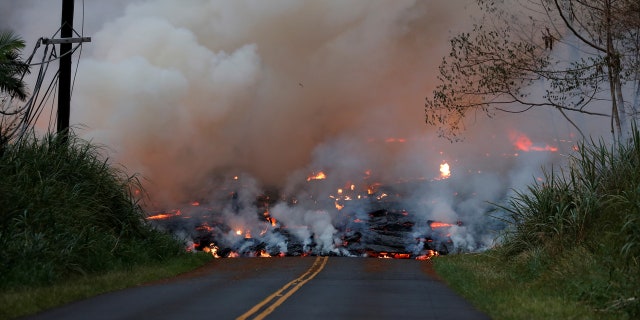 A lava flow advances down Leilani Street close to Nohea Street, in the Leilani Estates near Pahoa, Hawaii, U.S., May 27, 2018.