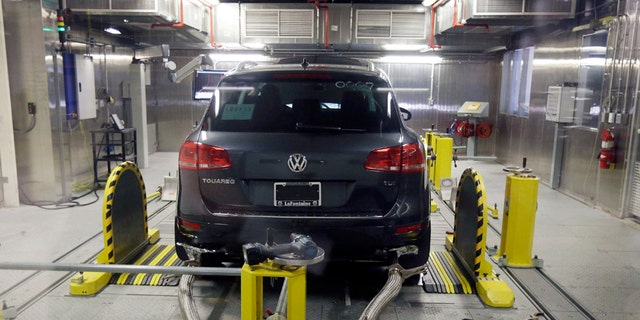 FILE - In this Oct. 13, 2015, file photo, a Volkswagen Touareg diesel is tested in the Environmental Protection Agency's cold temperature test facility in Ann Arbor, Mich. The imminent criminal plea deal between Volkswagen and U.S. prosecutors in an emissions-cheating scandal could be bad news for one group of people: VW employees who had a role in the deceit or subsequent cover-up. VW on Tuesday, Jan. 10, 2017, disclosed that it is in advanced talks to settle the criminal case by pleading guilty to unspecified charges and paying $4.3 billion in criminal and civil fines, a sum far larger than any recent case involving the auto industry. (AP Photo/Carlos Osorio, File)