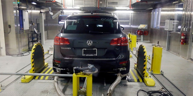 FILE - In this Oct. 13, 2015, file photo, a Volkswagen Touareg diesel is tested in the Environmental Protection Agency's cold temperature test facility in Ann Arbor, Mich. The imminent criminal plea deal between Volkswagen and U.S. prosecutors in an emissions-cheating scandal could be bad news for one group of people: VW employees who had a role in the deceit or subsequent cover-up. VW on Tuesday, Jan. 10, 2017, disclosed that it is in advanced talks to settle the criminal case by pleading guilty to unspecified charges and paying $4.3 billion in criminal and civil fines, a sum far larger than any recent case involving the auto industry. (AP Photo/Carlos Osorio, File)