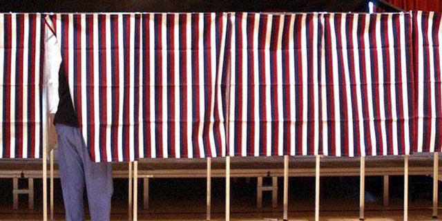 FILE: Feb. 2004: Voter in voting booth during Super Tuesday primary, Montpellier, Vt.
