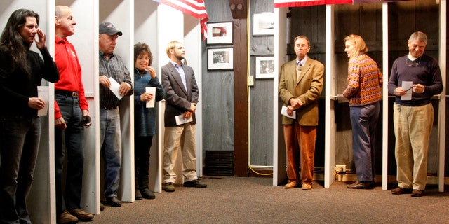 Voters in Dixville Notch wait to cast the first election day ballots in the 2012 general election.