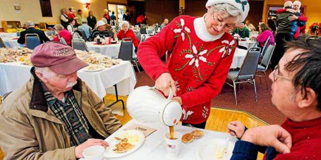 Dec. 2011: Connie Howe pours coffee for Ronald Read, left, and Dave Smith during the Charlie Slate Memorial Christmas breakfast at the American Legion.