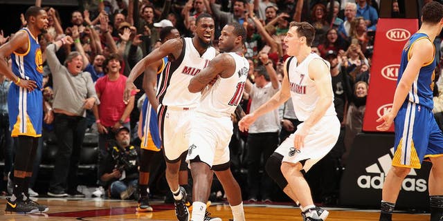 MIAMI, FL - JANUARY 23: Dion Waiters #11 of the Miami Heat celebrates with his team after making the game winning shot during the game against the Golden State Warriors on January 23, 2017 at American Airlines Arena in Miami, Florida. NOTE TO USER: User expressly acknowledges and agrees that, by downloading and or using this Photograph, user is consenting to the terms and conditions of the Getty Images License Agreement. Mandatory Copyright Notice: Copyright 2017 NBAE (Photo by Issac Baldizon/NBAE via Getty Images)