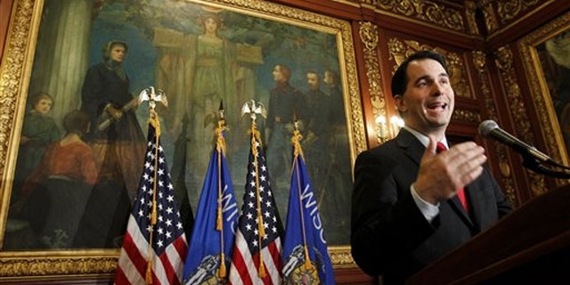 In this Feb. 17 photo, Wisconsin Gov. Scott Walker talks to the media at the State Capitol in Madison, Wis.