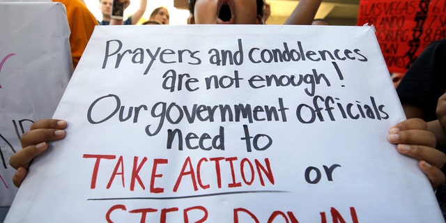 A student protester chants at a rally calling for more gun control three days after the shooting at Marjory Stoneman Douglas High School, in Fort Lauderdale, Florida, Feb. 17, 2018.