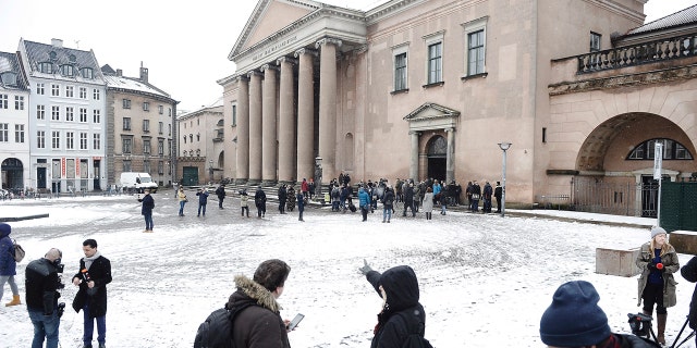 Members of the media set up in front of the courthouse where the trial of Danish inventor Peter Madsen, charged with murdering and dismembering Swedish journalist Kim Wall aboard his homemade submarine begins, in Copenhagen, Thursday, March 8, 2018.
