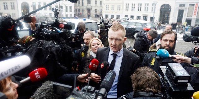 Prosecutor Jakob Buch-Jepsen, centre, arrives at the courthouse where the trial of Danish inventor Peter Madsen, charged with murdering and dismembering Swedish journalist Kim Wall aboard his homemade submarine begins, in Copenhagen, Thursday, March 8, 2018.