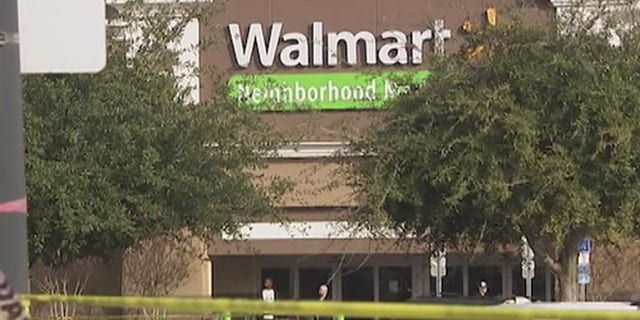 Police tape in front of the Pine Hills Walmart Saturday.