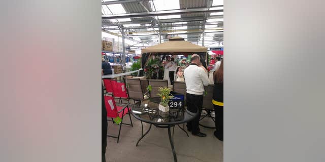 Walmart employees Leida Torres and Chrissy Slonaker exchanged vows in the garden section of the major retailer during store hours Saturday.