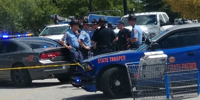 Police converged on a Walmart in Covington, Georgia, after police exchanged gunfire with a shoplifting suspect. An officer was wounded the suspect was killed.
