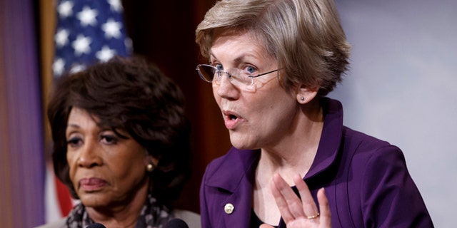 Dec. 10, 2014: Sen. Elizabeth Warren, D-Mass., a member of the Senate Banking Committee, right, and Rep. Maxine Waters, D-Calif., ranking member of the House Financial Services Committee, express their outrage to reporters that a huge, $1.1 trillion spending bill approved by the Republican-controlled House yesterday contains changes to the 2010 Dodd-Frank law that regulates complex financial instruments known as derivatives.