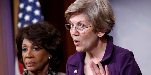 Dec. 10, 2014: Sen. Elizabeth Warren, D-Mass., a member of the Senate Banking Committee, right, and Rep. Maxine Waters, D-Calif., ranking member of the House Financial Services Committee, express their outrage to reporters that a huge, $1.1 trillion spending bill approved by the Republican-controlled House yesterday contains changes to the 2010 Dodd-Frank law that regulates complex financial instruments known as derivatives.