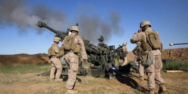 The U.S. Army is developing precision-guided 155mm rounds that are longer range and able to fire in GPS-denied war. (Credit: US Marine Corps)