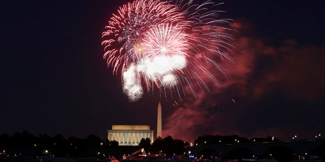 Fireworks explode over the Lincoln and Washington Monuments as Independence Day is celebrated in Washington, D.C.