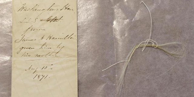Strands of George Washington's hair were discovered in an envelope tucked inside a leather book, “Gaines Universal Register or American and British Kalendar for the year 1793.”