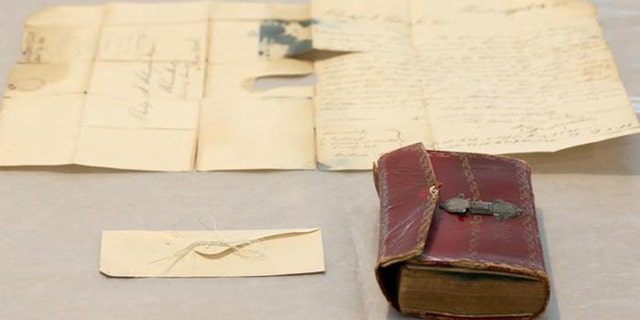 Strands of George Washington's hair were discovered in an envelope tucked inside a leather book, “Gaines Universal Register or American and British Kalendar for the year 1793.”