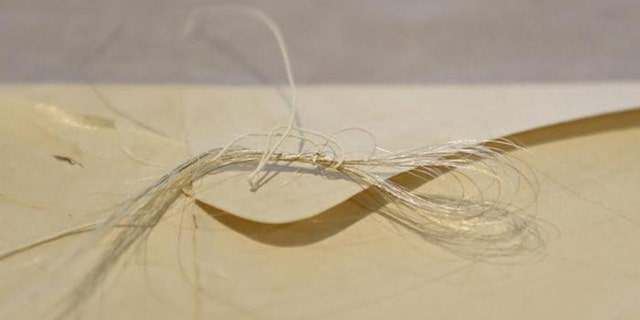 Strands of George Washington's hair were discovered in an envelope tucked inside a leather book, “Gaines Universal Register or American and British Kalendar for the year 1793.”