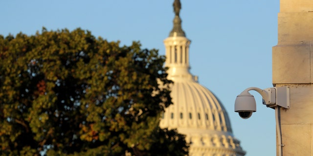 A security camera hangs near the U.S. Capitol in Washington, U.S., Nov. 7, 2016. (REUTERS/Joshua Roberts)