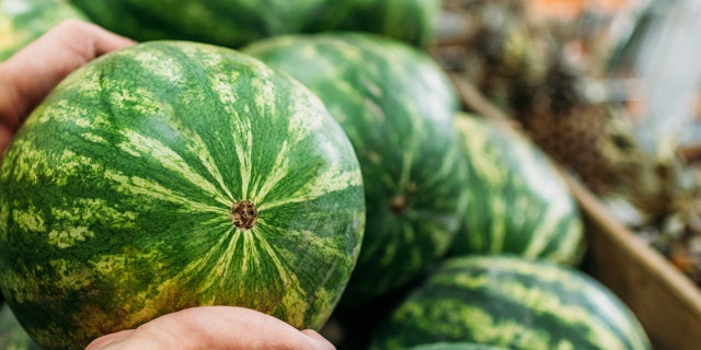 Video of a little boy trying to lift a watermelon has gone viral.