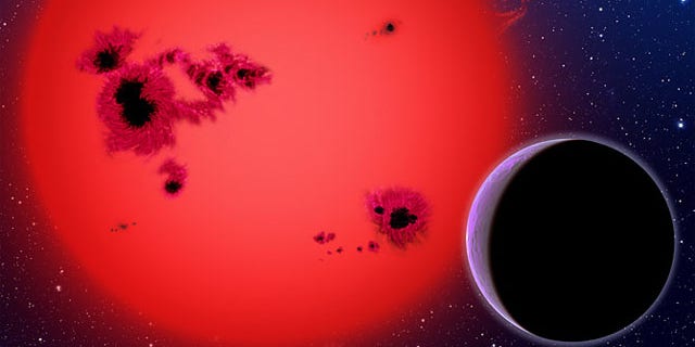Essentially one big ocean, GJ 1214b orbits a red dwarf star in this artist's conception. Researchers now believe the "water world" represents an new type of planet.