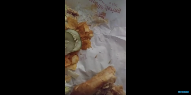 This screenshot is from a video posted on YouTube by a man in New Jersey claiming to have found maggots in his Wawa sandwich.