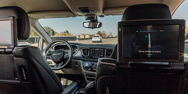 This Sunday, Oct. 29, 2017, photo provided by Waymo shows a Chrysler Pacifica minivan that are equipped with Waymo's self-driving car technology, being tested at Waymo's facility in Atwater, Calif. Waymo, hatched from a Google project started eight years ago, showed off its progress Monday during a rare peek at a closely guarded testing facility located 120 miles southeast of San Francisco where its robots complete their equivalent to driver's education. (Julia Wang/Waymo via AP)