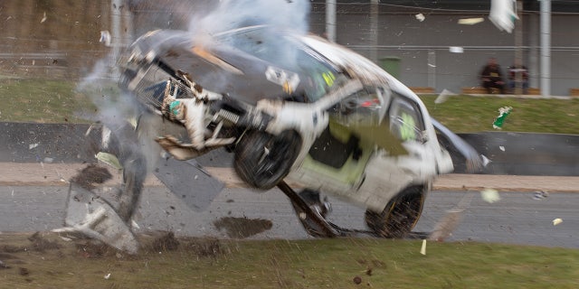 The front brakes on the race-prepared Mitsubishi EVO failed and the car went off course.