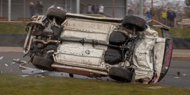 A roll cage protected the driver during the barrel-roll.