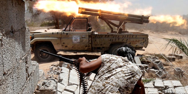 Libyan forces allied with the U.N.-backed government fire weapons during a battle with ISIS fighters in Sirte, Libya, July 21, 2016.