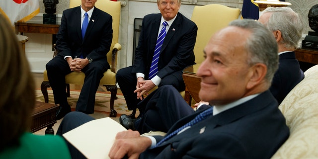 Vice President Mike Pence looks on with President Donald Trump during a meeting with Senate Minority Leader Chuck Schumer, D-N.Y., and other Congressional leaders in the Oval Office of the White House, Wednesday, Sept. 6, 2017, in Washington. (AP Photo/Evan Vucci)