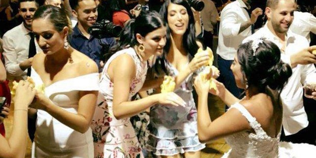 Nancy Mowad, seen on the right, arranged to surprise guests with the late-night snack following a more traditional six-course meal.