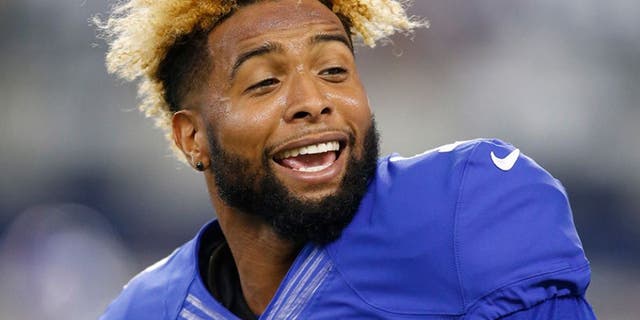 Sep 13, 2015; Arlington, TX, USA; New York Giants wide receiver Odell Beckham (13) smiles on the field prior to the game against the Dallas Cowboys at AT&amp;T Stadium. Mandatory Credit: Tim Heitman-USA TODAY Sports