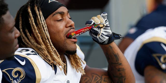 LANDOVER, MD - SEPTEMBER 20: Tre Mason #27 of the St. Louis Rams eats candy on the sidelines during the second half against the Washington Redskins at FedExField on September 20, 2015 in Landover, MD. (Photo by Rob Carr/Getty Images)