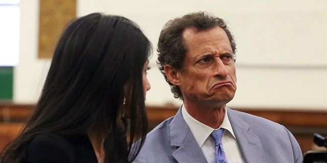 Anthony Weiner, right, and Huma Abedin appear in a New York court on Sept. 13.