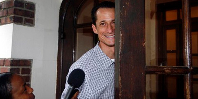 Rep. Anthony Weiner enters his home in New York June 11.