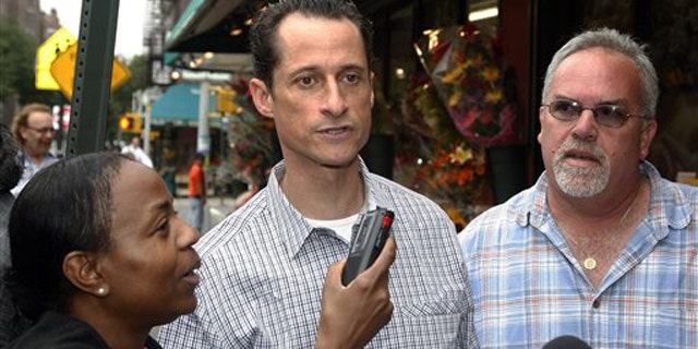 June 11: Rep. Anthony Weiner is interviewed as he walks down the street near his home in the Queens borough of New York.