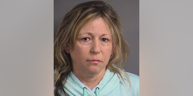Authorities say Wendy Young, 49, consumed about a dozen beers before an infant in her care was found unresponsive and died in a hospital.
