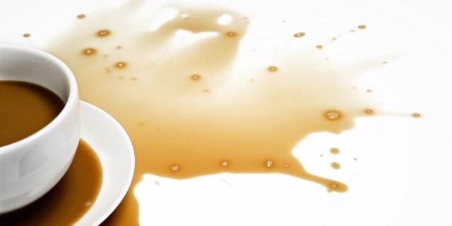 Spilled Coffee on White Desk