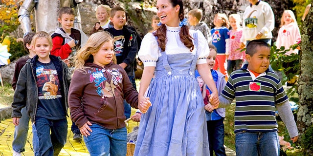 Guests follow the Yellow Brick Road with Dorothy at Land of Oz.