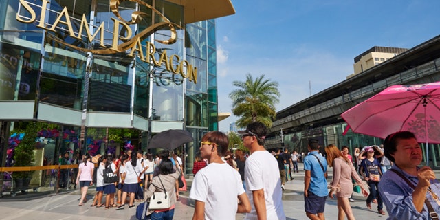 Bangkok, Thailand - September 20, 2014: customers entering at Siam Paragon, a luxury shopping mall located in Pathum District. Bangok. Thailand.