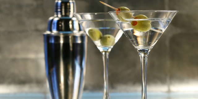 Martinis with olives and shaker on bar
