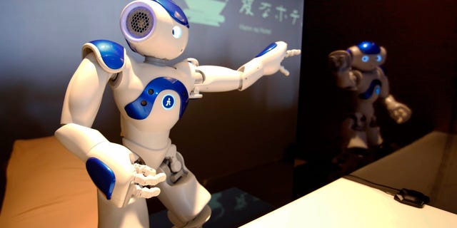 A receptionist robot performs during a demonstration for the media at the Henn na Hotel or Weird Hotel, in Sasebo, southwestern Japan on July 15, 2015.